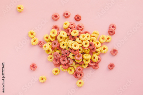 Corn rings in glaze for breakfast on yellow background