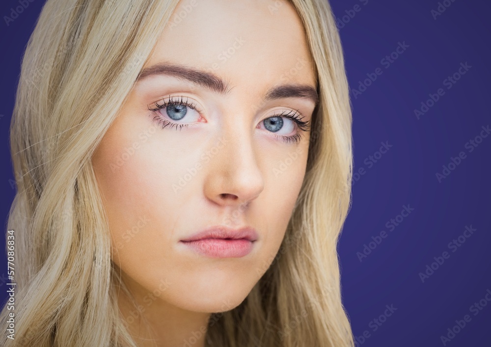Portrait of caucasian woman against copy space on blue background Portrait of caucasian woman against copy space on blue background