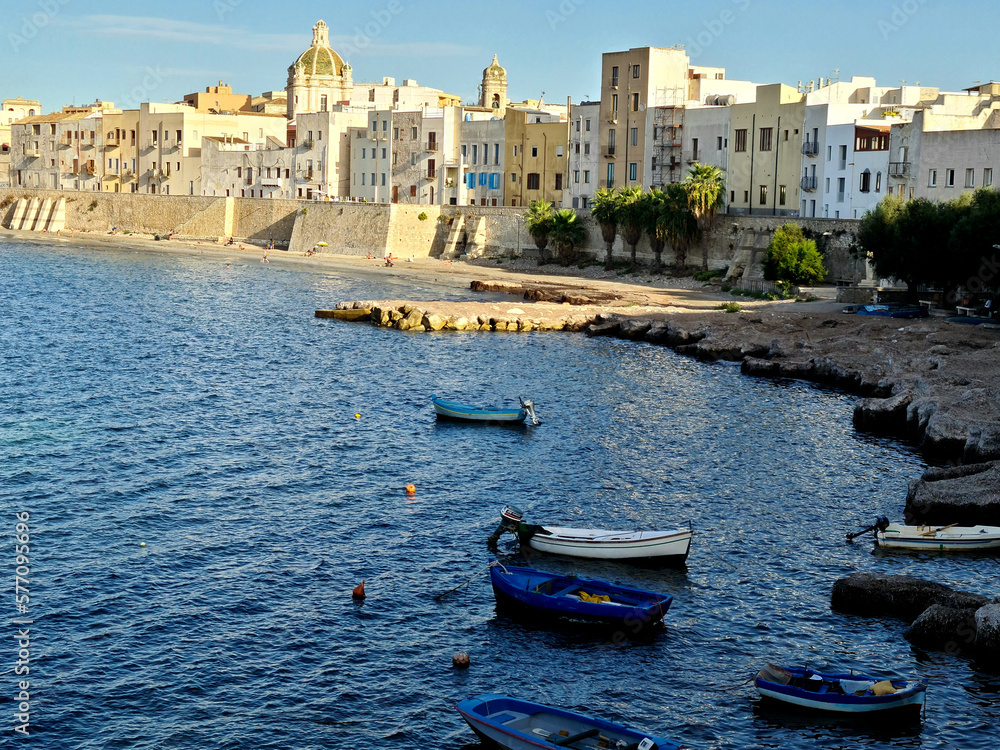 panorama of the seafront of the Mura di Tramontana in the historic center of Trapani where the dome of the Cathedral of San Lorenzo stands out.