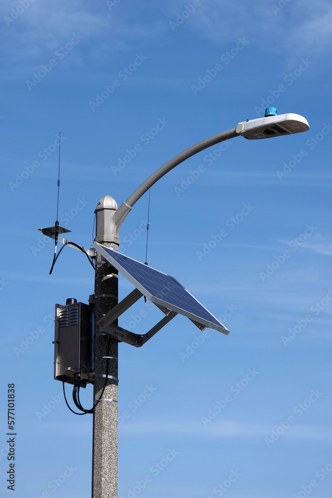 High tech street light with solar panel and a communication unit with