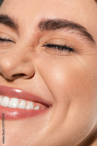 close up of positive young woman with flawless and natural makeup.