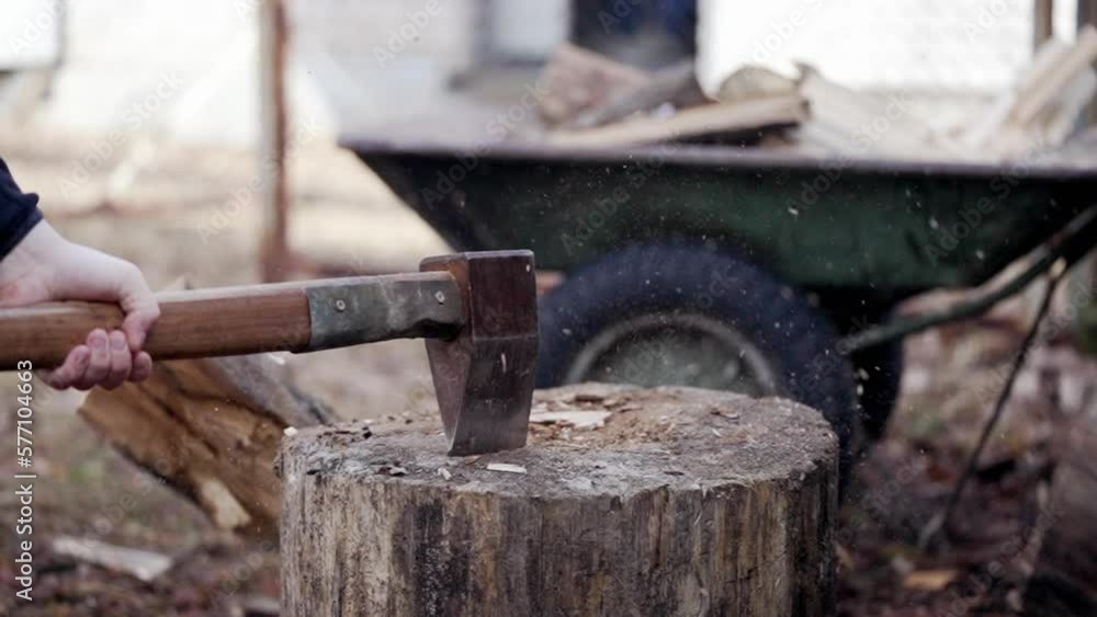 The log shatters into pieces from the blow of an ax The log shatters into pieces from the blow of an ax