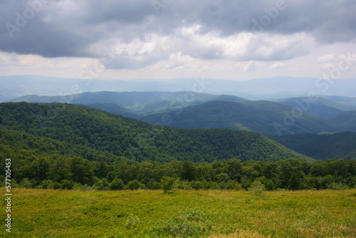 nature scenery with hills and meadows. summer mountain landscape with clouds on the sky