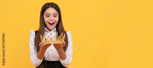 amazed schoolgirl in crown. self confident queen kid. expressing smug. arrogant princess. Child queen princess in crown horizontal poster design. Banner header, copy space.