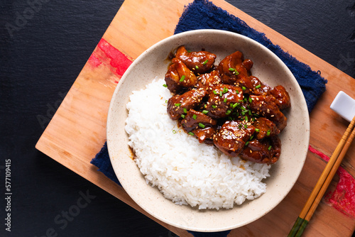 Food concept Asian sweet Glazed Pork and rice on black slate stone background with copy space