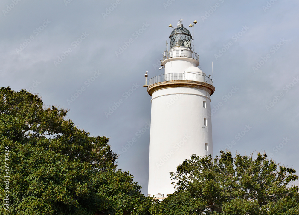 La Farola lighthouse in Malaga, an old coastal building in the harbour, Spain La Farola lighthouse in Malaga, an old coastal building in the harbour, Spain