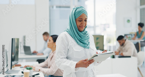 Office, business and muslim woman on tablet for research, internet browsing or social media. Technology, break and mature Islamic female holding touchscreen for networking, typing or writing email.