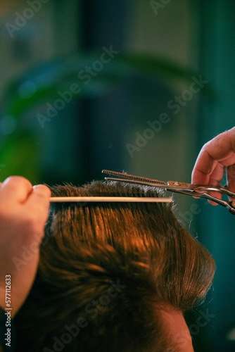 Barbershop, close-up of cutting hair. Vintage style. High quality photo