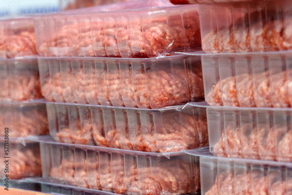 Raw minced Meat in a transparent Plastic Container, sell in supermarkets. Selective focus