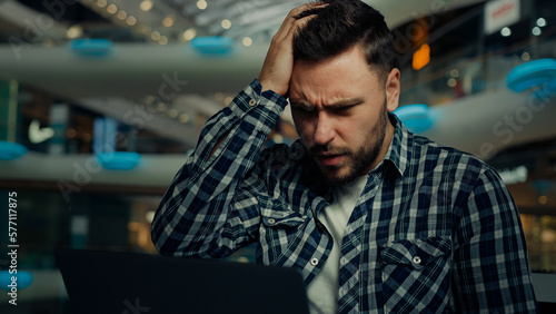 Фотография Disappointed depressed sad businessman freelancer caucasian man has problem with