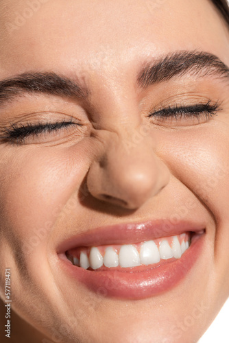 close up of happy young woman with flawless natural makeup.
