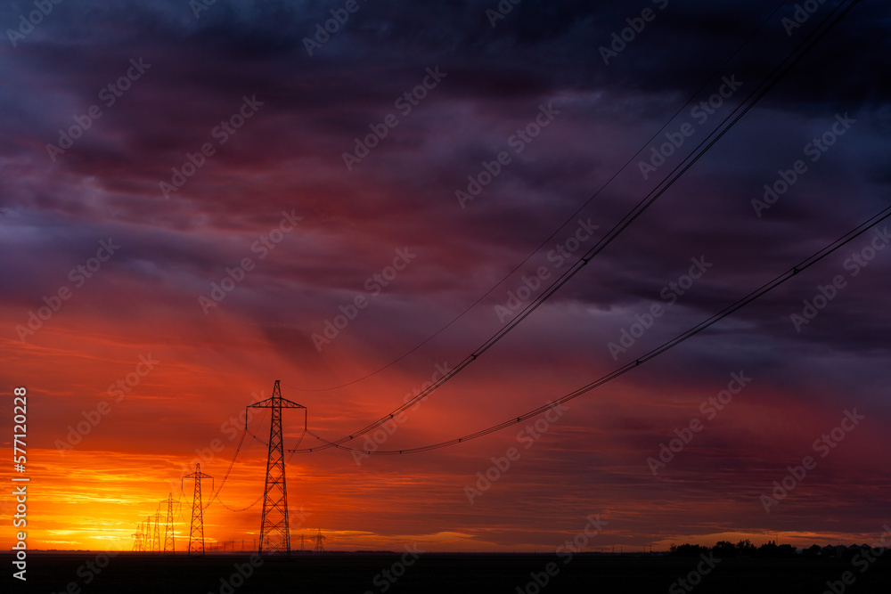 Powerlines stand strong agains the sunset