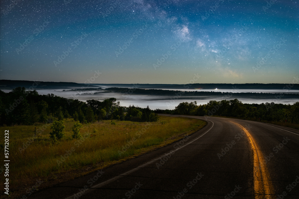 Milky Way over a fog filled valley