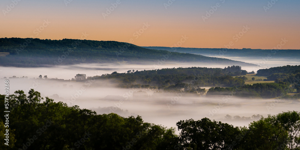 Valley filled with fog at moon light