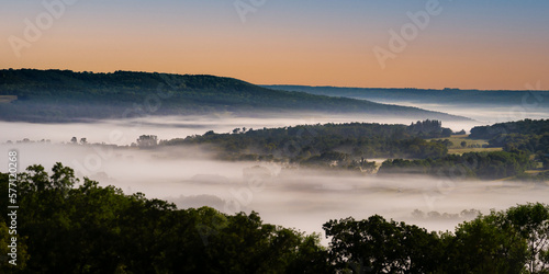 Valley filled with fog at moon light