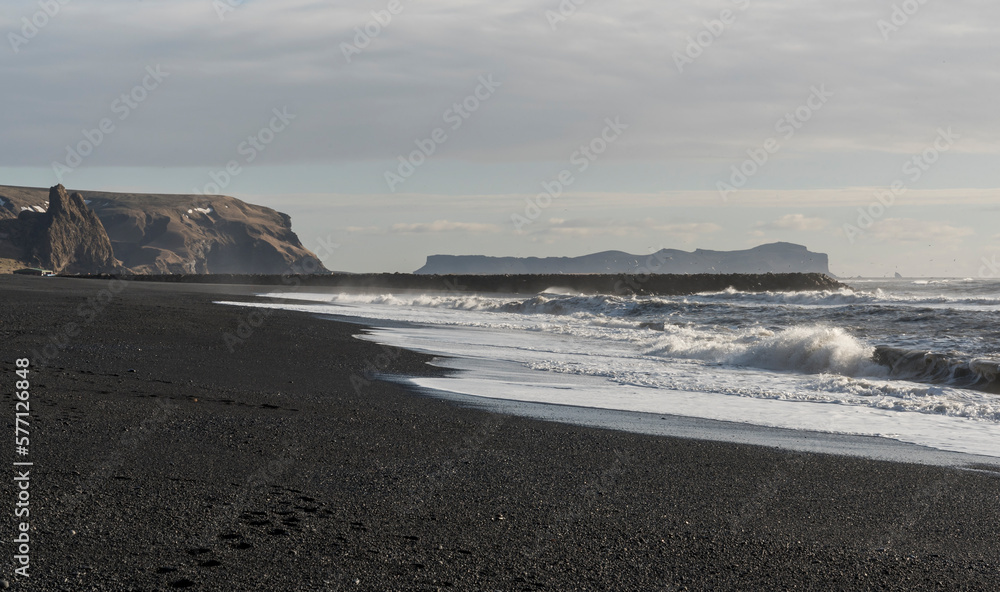Beach in Vík í Mýrdal with black sand and cliffs in the background, South coast of Iceland