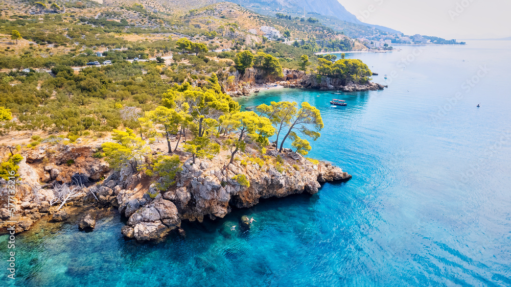 Get lost in the picturesque scene of Croatia's beach, with its stunning turquoise waters and pristine coastline. From above, the aerial view showcases the perfect spot for a vacation and adventure.