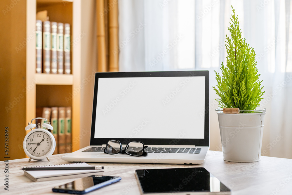 Comfortable Workplace With Blank Screen Laptop, Smartphone, Tablet And Office Supplies Comfortable Workplace With Blank Screen Laptop, Smartphone, Tablet And Office Supplies