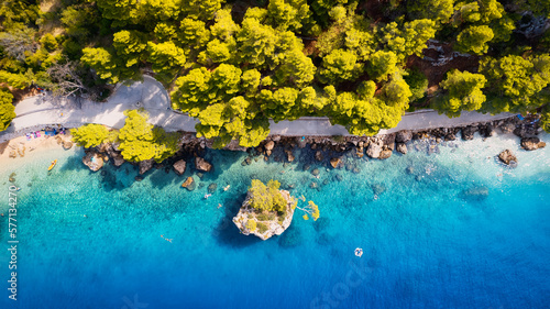Fototapeta Naklejka Na Ścianę i Meble -  A drone captured the stunning aerial view of Croatia's coastal area, which features crystal-clear blue water and lush forests on land.