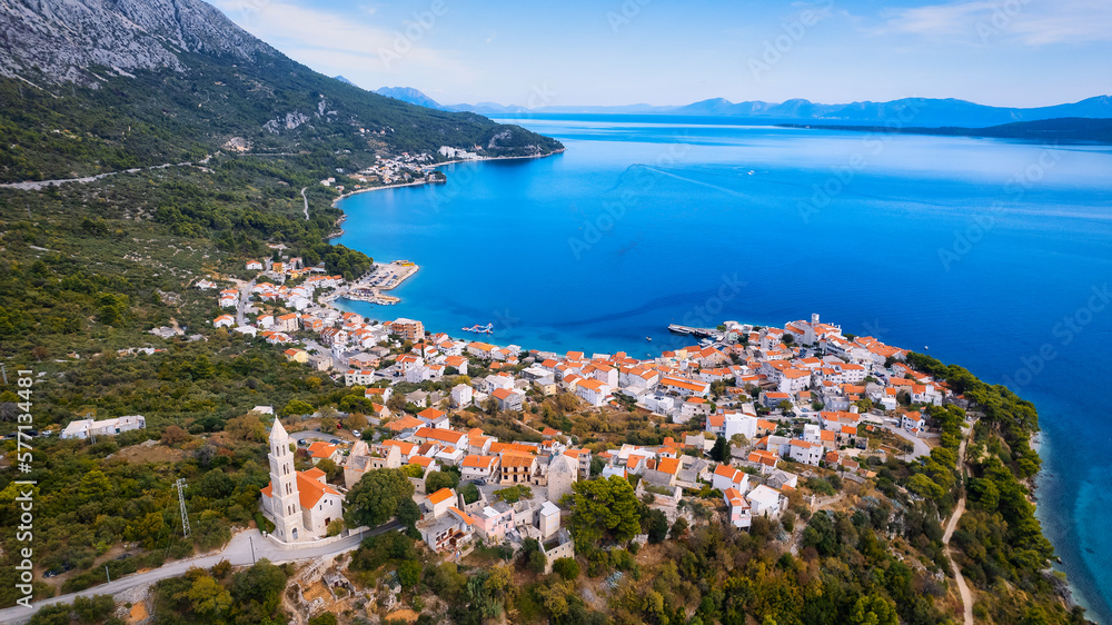 Get lost in the picturesque scene of Croatia's beach, with its stunning turquoise waters and pristine coastline. From above, the aerial view showcases the perfect spot for a vacation and adventure.