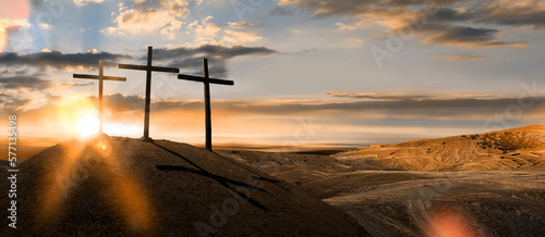 Fotografie Three wooden crosses on a hill in the morning