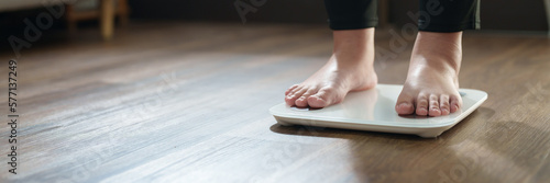 Bild auf Leinwand Woman feet standing on digital scales for diet control..