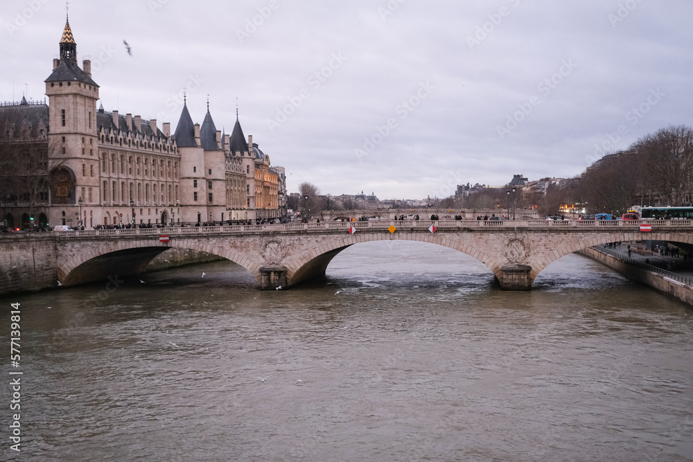 Evening photo of bridge over Seine river in Paris, France
