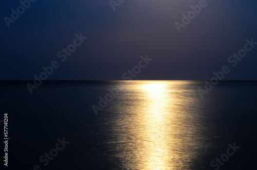reflection of moonlight on the sea surface at night