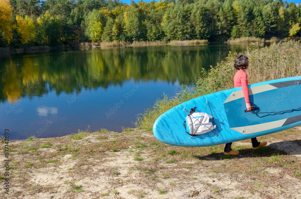 Active woman with SUP board near beautiful lake, nature on background, stand up paddling water adventure outdoors, sport and healthy lifestyle concept
Active woman with SUP board near beautiful lake, nature on background, stand up paddling water adventure outdoors, sport and healthy lifestyle concept