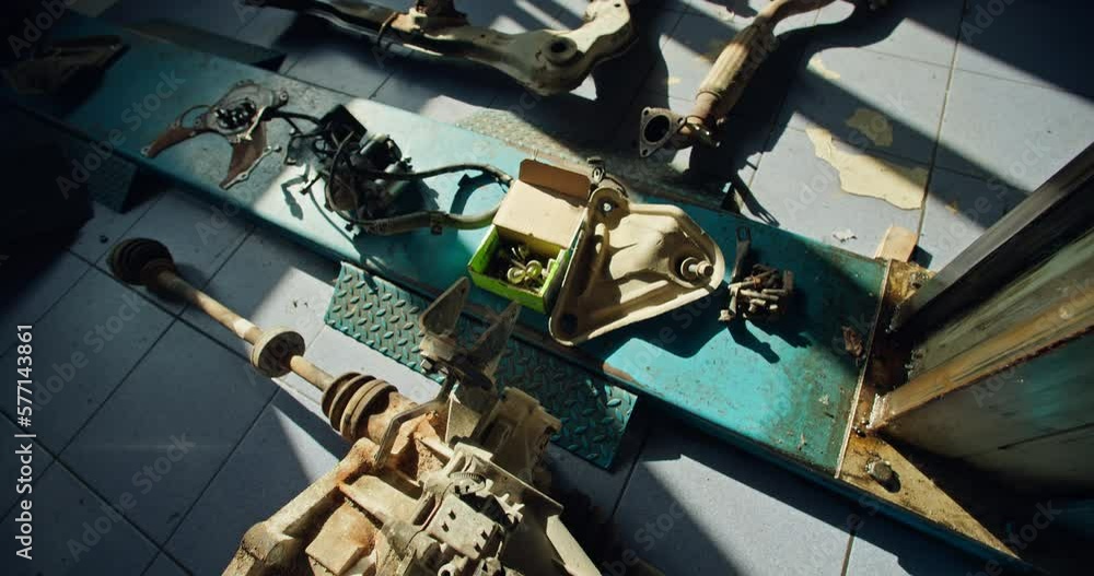 The spare parts of the waste part of the car lie at the service station. Car repair by professionals. High quality 4k footage The spare parts of the waste part of the car lie at the service station. Car repair by professionals. High quality 4k footage