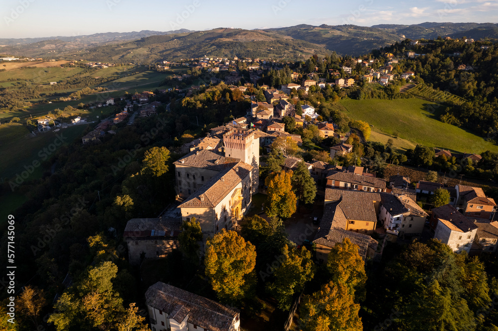 4k drone flight over the Castle of Guiglia and its forest at golden hour in Italy 