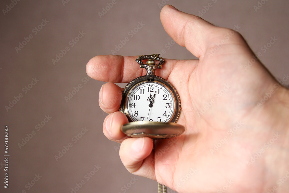 a pocket watch in the hands of a man a pocket watch in the hands of a man
