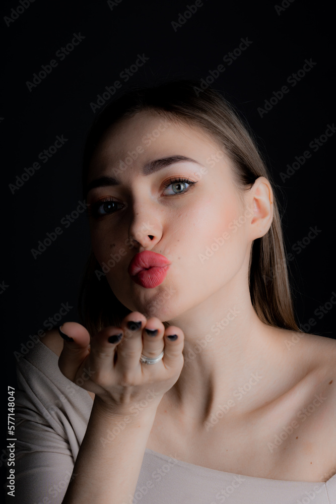 Portrait of a young girl on a black background Portrait of a young girl on a black background