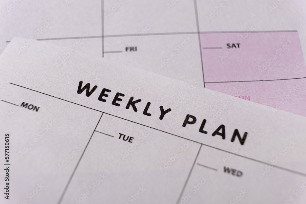 Weekly planner. Calendar reminder, organizer, schedule, planning concept. Close-up of weekly plan paper - obrazy, fototapety, plakaty 
