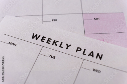 Weekly planner. Calendar reminder, organizer, schedule, planning concept. Close-up of weekly plan paper