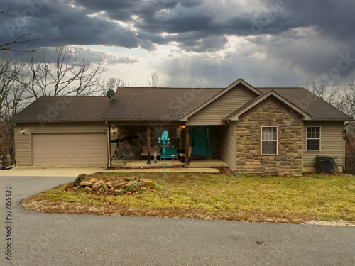 View of a typical suburban house with a stormy sky