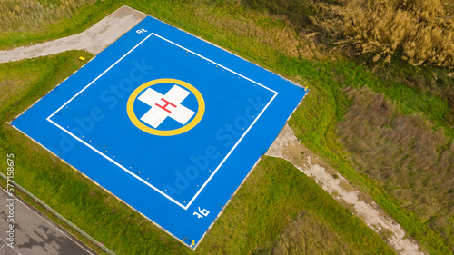 Bild auf Leinwand Aerial closeup of a helicopter landing pad near emergency hospital and medical centre