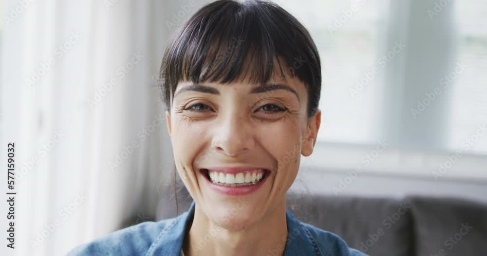 Portrait of happy caucasian woman wearing jacket in living room Portrait of happy caucasian woman wearing jacket in living room