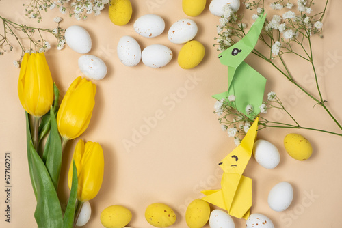 Happy Easter - layout with space for text center, Easter bunnies made of origami paper and eggs, top view