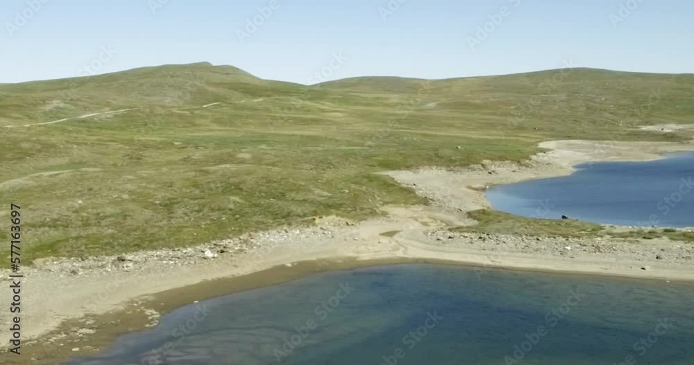 Aerial view of fell landscape at lake Guolasjavri reservoir in summer, Birtavarre, Troms og Finnmark, Norway. Aerial view of fell landscape at lake Guolasjavri reservoir in summer, Birtavarre, Troms og Finnmark, Norway.