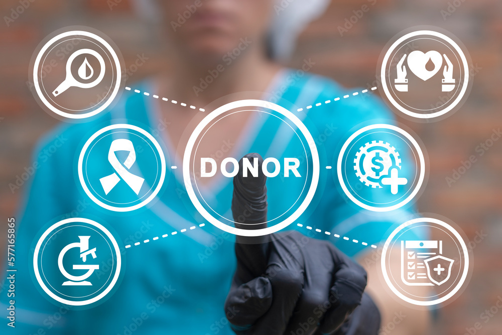Doctor using virtual touchscreen presses word: DONOR. Blood donation concept. Blood and plasma donating. Blood transfusion. World blood donor day. Doctor using virtual touchscreen presses word: DONOR. Blood donation concept. Blood and plasma donating. Blood transfusion. World blood donor day.