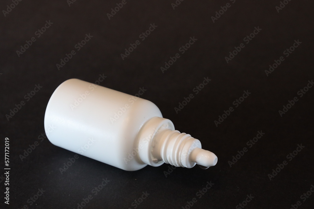 eye or ear drops bottle isolated on black background eye or ear drops bottle isolated on black background