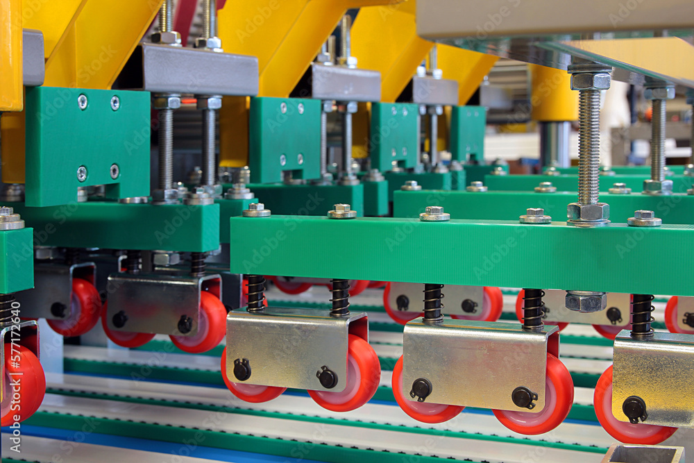 Colorful detail of an equipment fitted with belts and pulleys Colorful detail of an equipment fitted with belts and pulleys
