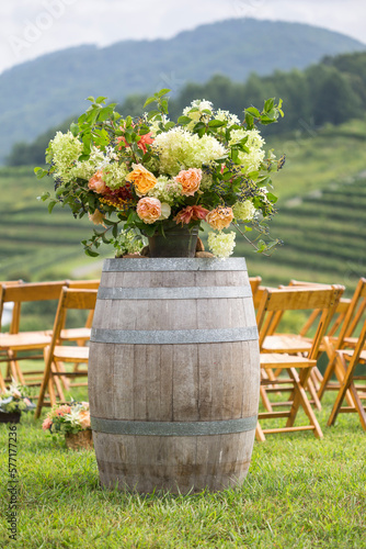 Rustic Wine-barrel flower arrangement at the ceremony. Wedding Decor