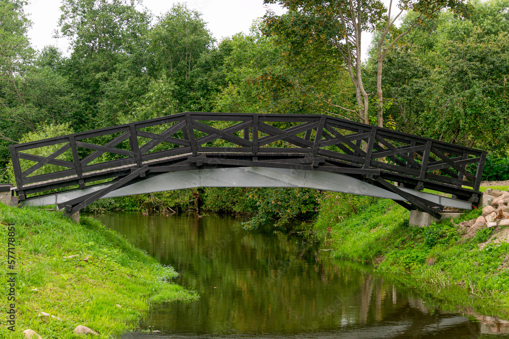 Pedestrian bridge across the moat near the old manor. Pedestrian bridge across the moat near the old manor.