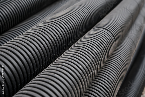 Wallpaper Mural Black building pipes, selective focus, coated corrugated pipes for road and electrical network repair, top view. Reconstruction and improvement of the social infrastructure of cities Torontodigital.ca