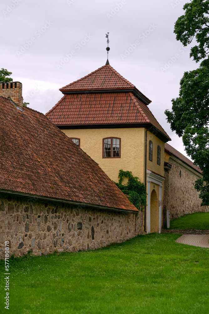 Fragment of an old manor, the walls of which are made of stones.