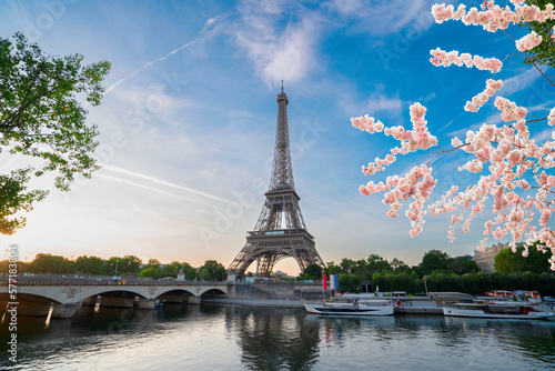 Paris Eiffel Tower and river Seine with sunrise in Paris, France. Eiffel Tower is one of the most iconic landmarks of Paris, web banner format ar early spring morning