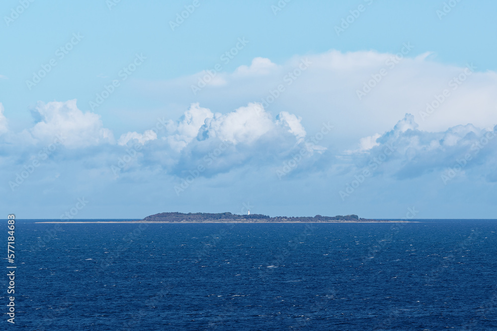 View from south side of island Hesselo with a lighthouse in the middle. This is a small island of Denmark situated in Kattegat, North sea.