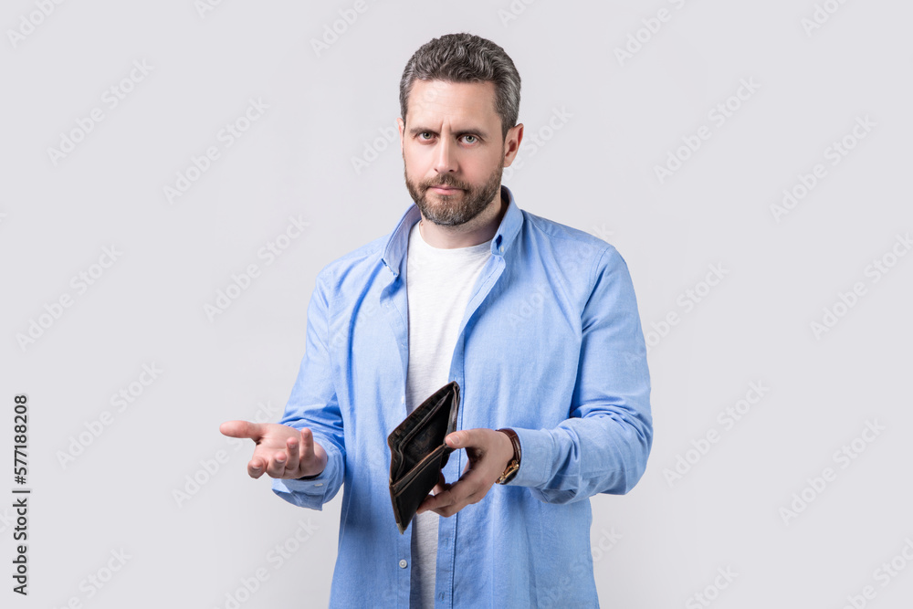 shrugging broke man with wallet isolated on studio background. broke man with wallet shrugging broke man with wallet isolated on studio background. broke man with wallet